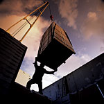 Picture of man moving a large crate 